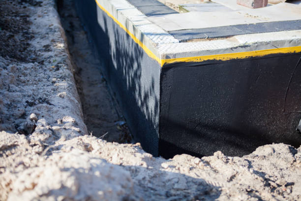 Professional Waterproofing technician working in Ellenwood, GA